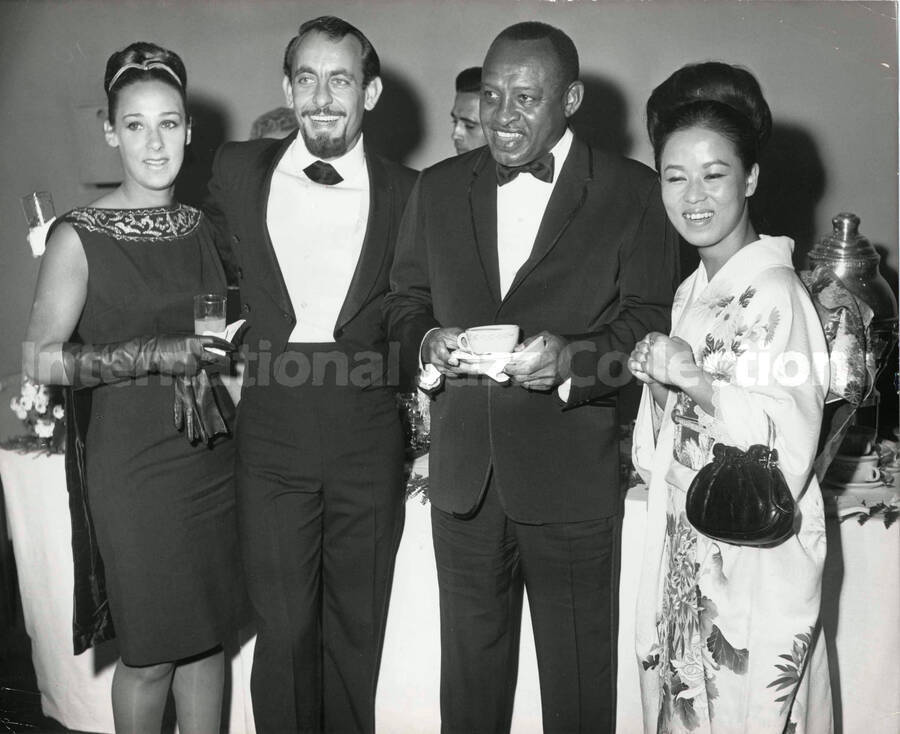 8 x 10 inch photograph. Lionel Hampton with unidentified persons including a woman dressed in Japanese costume [Yukari Kuroda?]