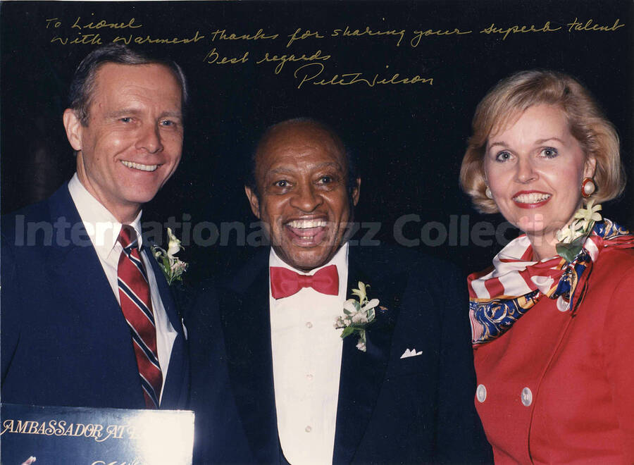 8 x 10 inch photograph. Lionel Hampton with Governor of California Peter Wilson and Mrs. Wilson. This photograph is dedicated to Lionel Hampton