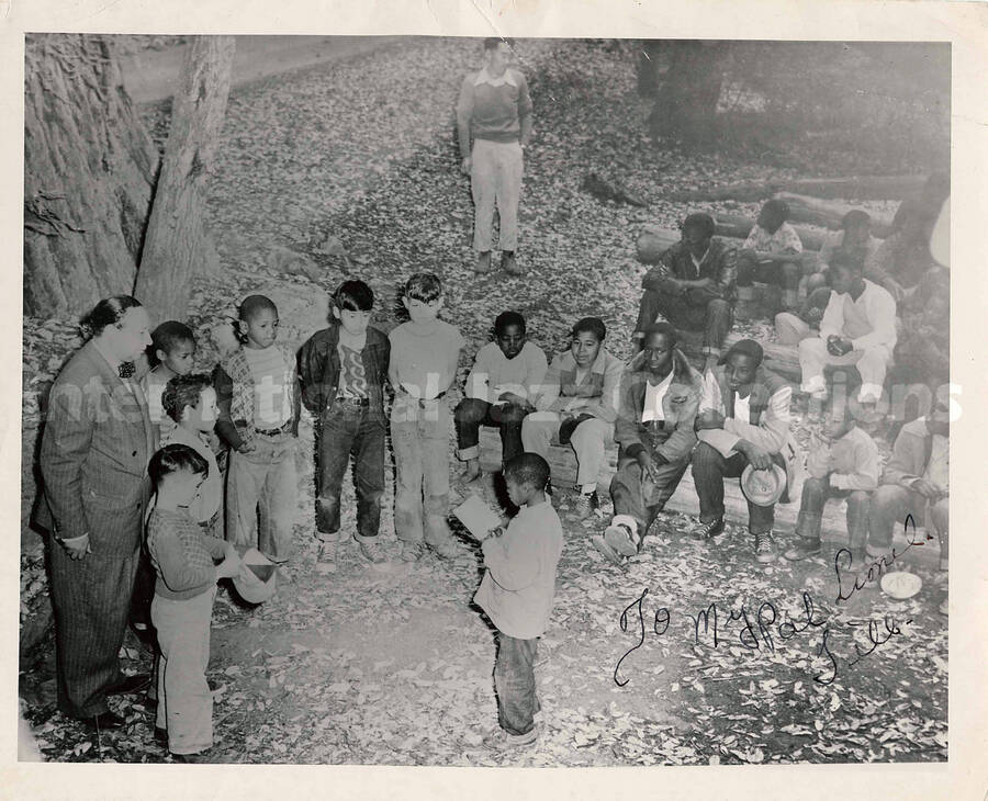 9 x 11 inch photograph.  Group of children and unidentified adults. This photograph is dedicated to Lionel Hampton