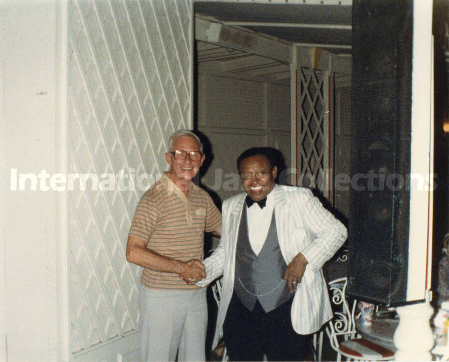 8 x 10 inch photograph. Lionel Hampton with unidentified man [at Disneyland]