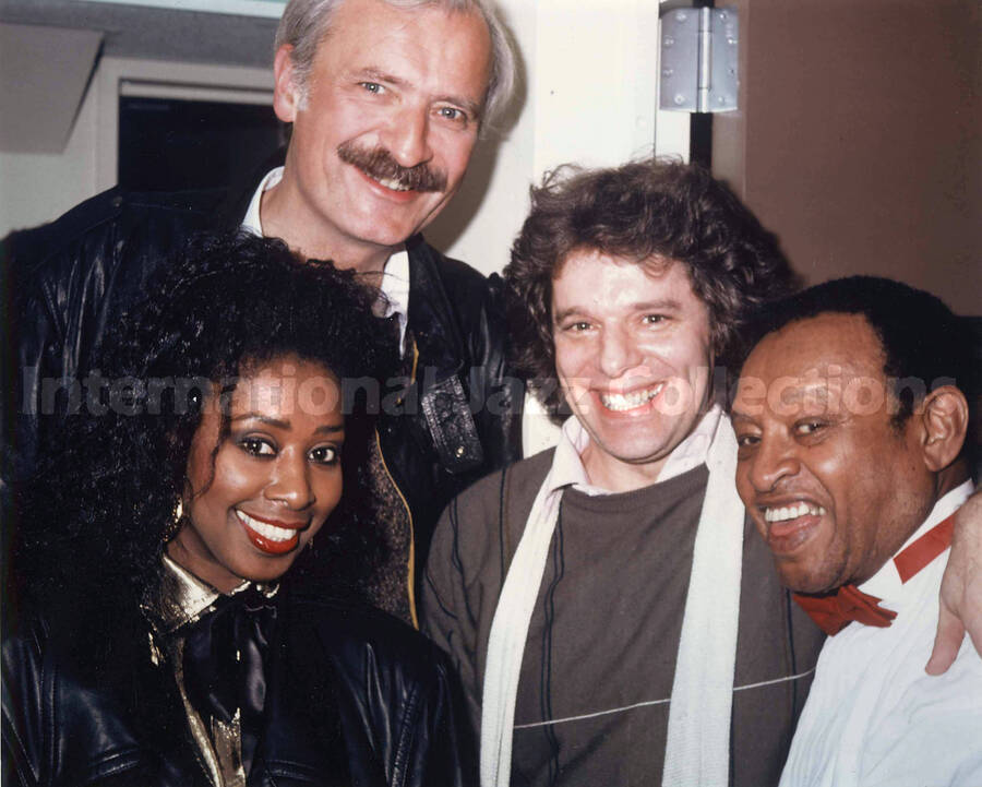 8 x 10 inch photograph. Lionel Hampton with unidentified persons