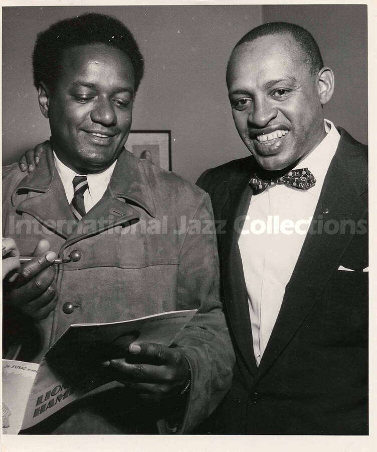 8 1/2 x 7 inch photograph. Lionel Hampton with unidentified man