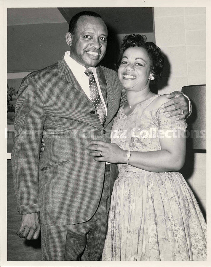 10 x 8 inch photograph. Lionel Hampton with unidentified woman [visiting a U.S. Air Force Base?]