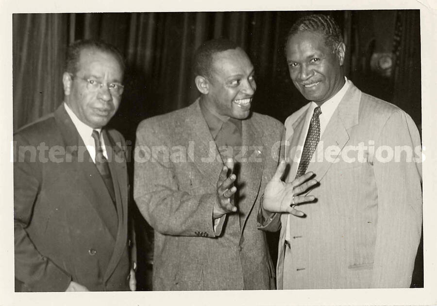 5 x 7 inch photograph. Lionel Hampton with two unidentified men