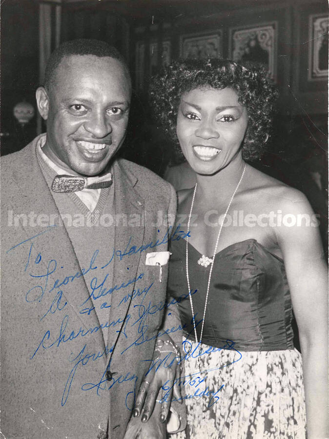 9 x 6 1/2 inch photograph. Lionel Hampton with unidentified woman. This photograph was dedicated to Lionel Hampton in Dusseldorf [Germany] from  [àMontesino?]