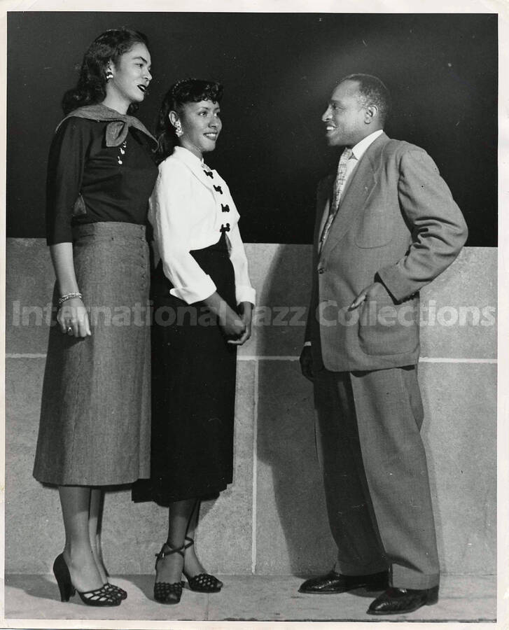 10 x 8 inch photograph. Lionel Hampton with two unidentified women