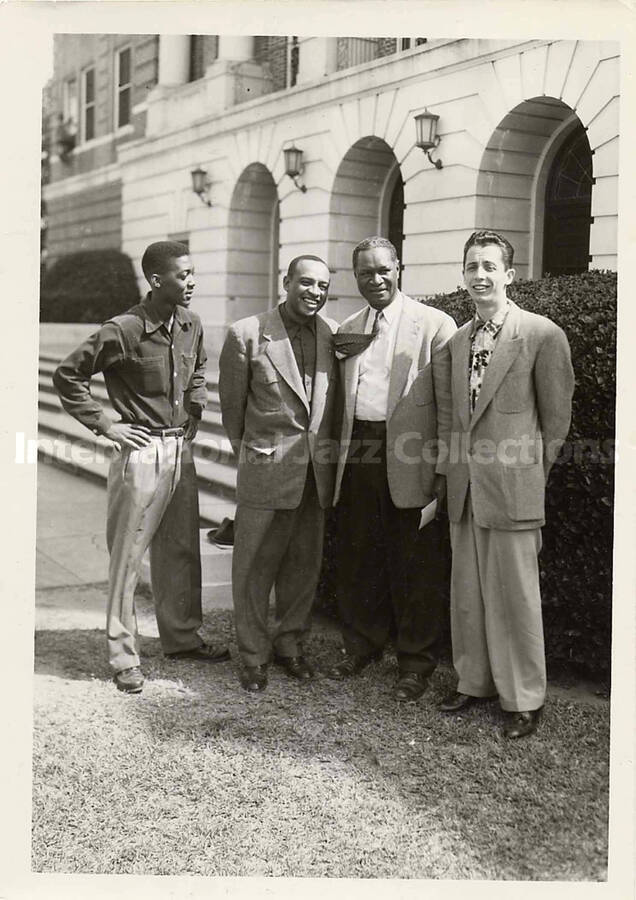 7 x 5 inch photograph. Lionel Hampton with three unidentified men