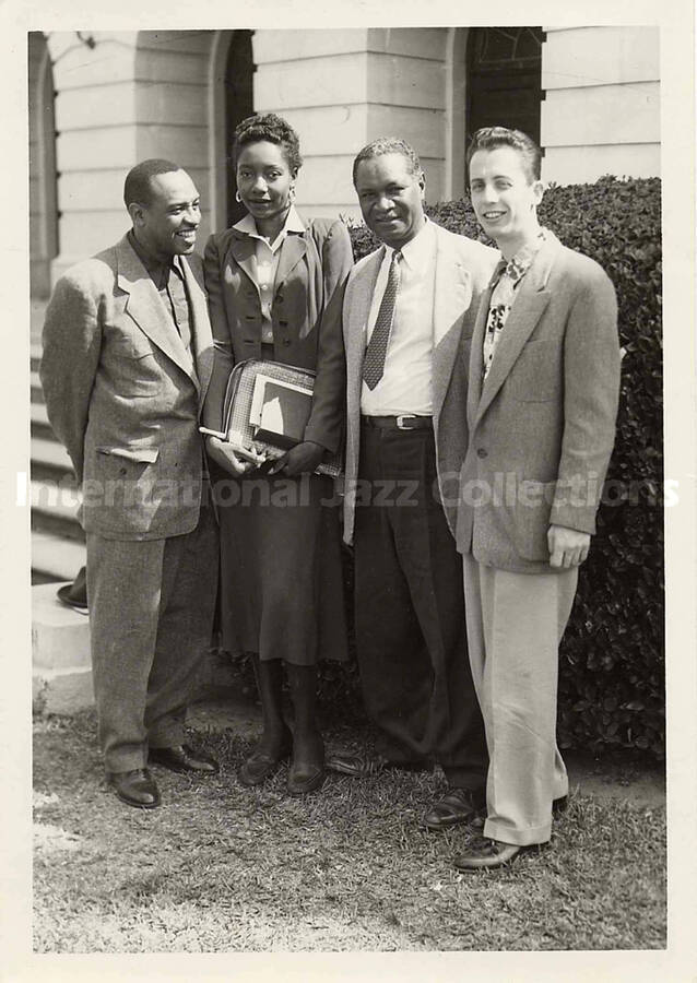 7 x 5 inch photograph. Lionel Hampton with unidentified persons