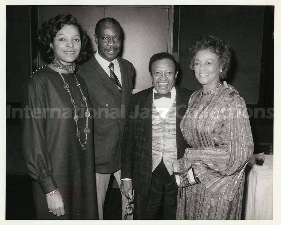 8 x 10 inch photograph. Lionel Hampton with two unidentified women and a man, on the occasion of his receiving the Henri M. Deas Award for Community Service presented by the Opportunities Industrialization Center of New York