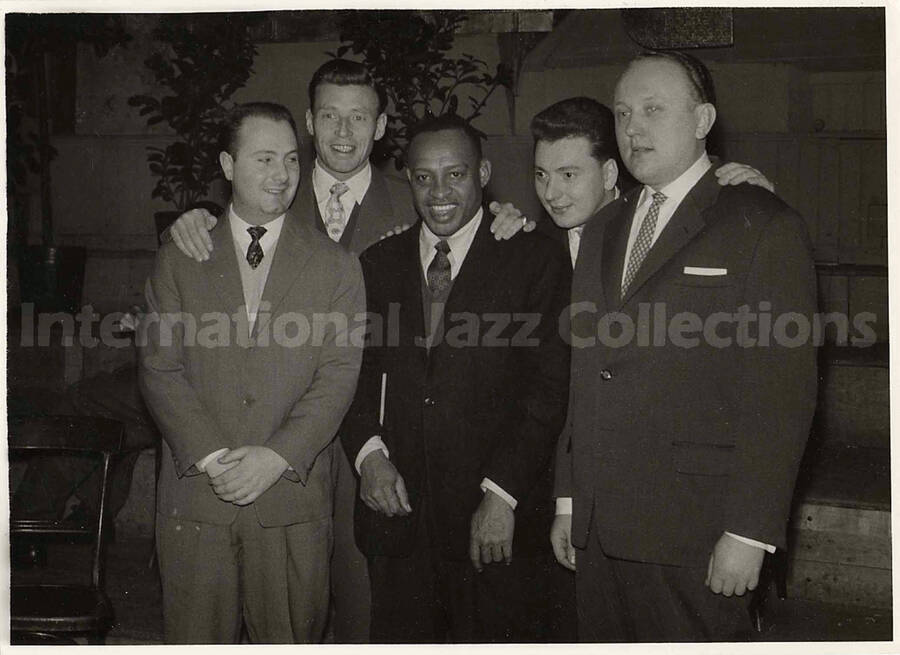 5 x 7 inch photograph. Lionel Hampton with four unidentified men