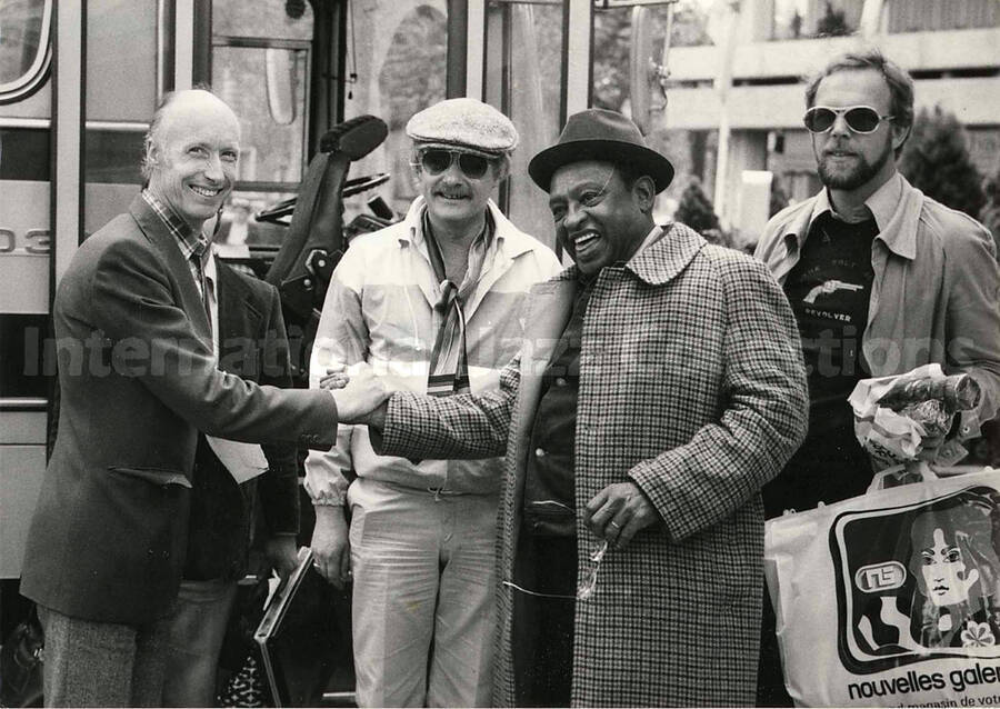 5 x 7 inch photograph. Lionel Hampton with unidentified men [in France?]