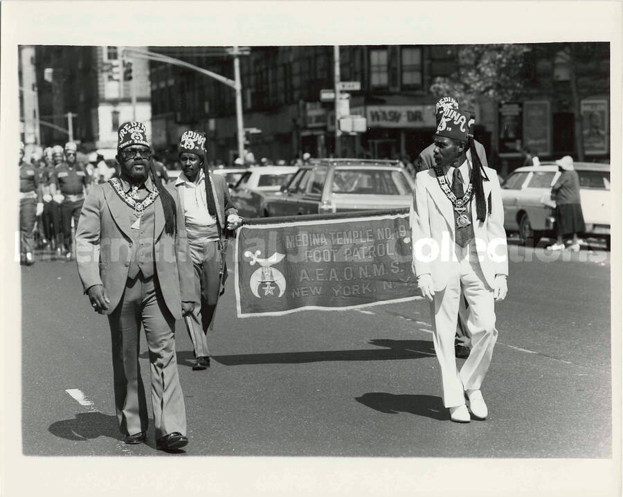 8 x 10 inch photograph. Medina Temple N. 19 Foot Patrol parades on the occasion of the Grand Opening of Lionel Hampton Houses in New York, NY