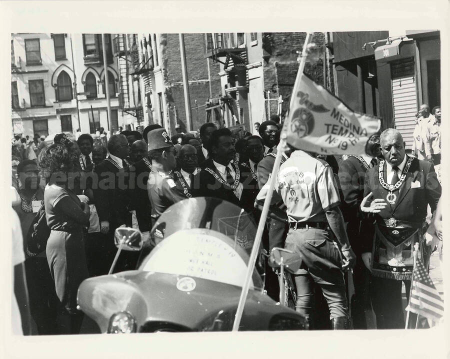 8 x 10 inch photograph. Medina Temple N. 19 Foot Patrol parades on the occasion of the Grand Opening of Lionel Hampton Houses in New York, NY