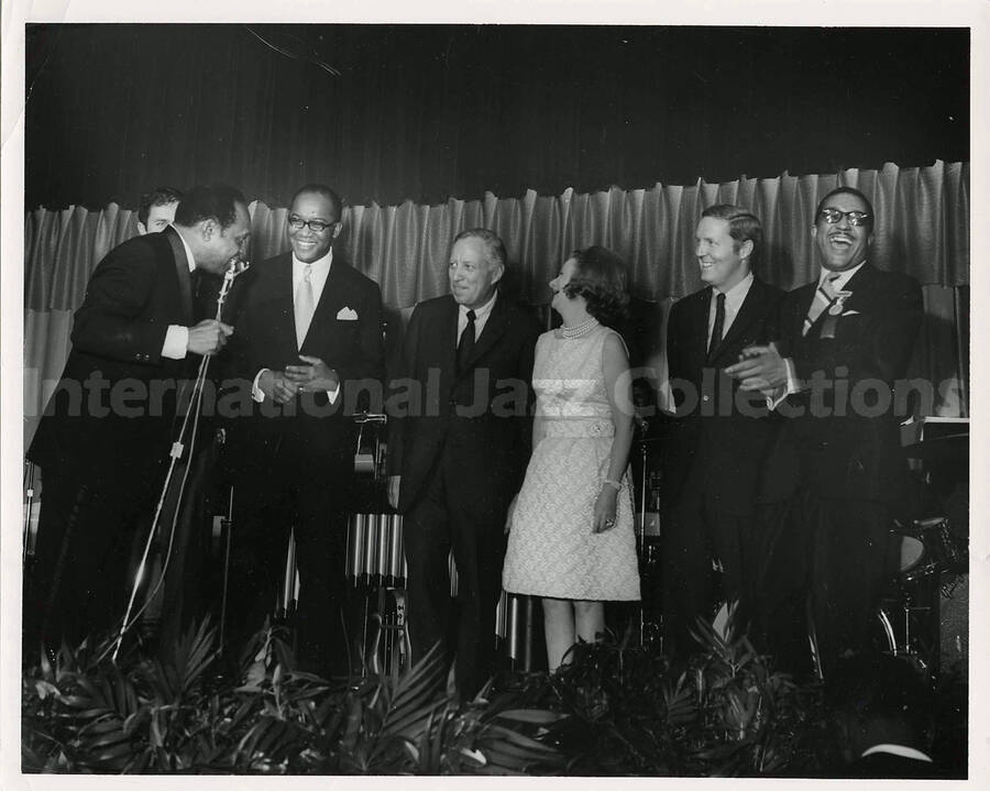 8 x 10 inch photograph. Lionel Hampton with unidentified persons