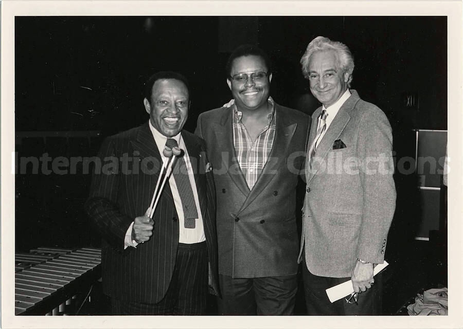 5 x 7 inch photograph. Lionel Hampton, Bill Titone, and an unidentified man