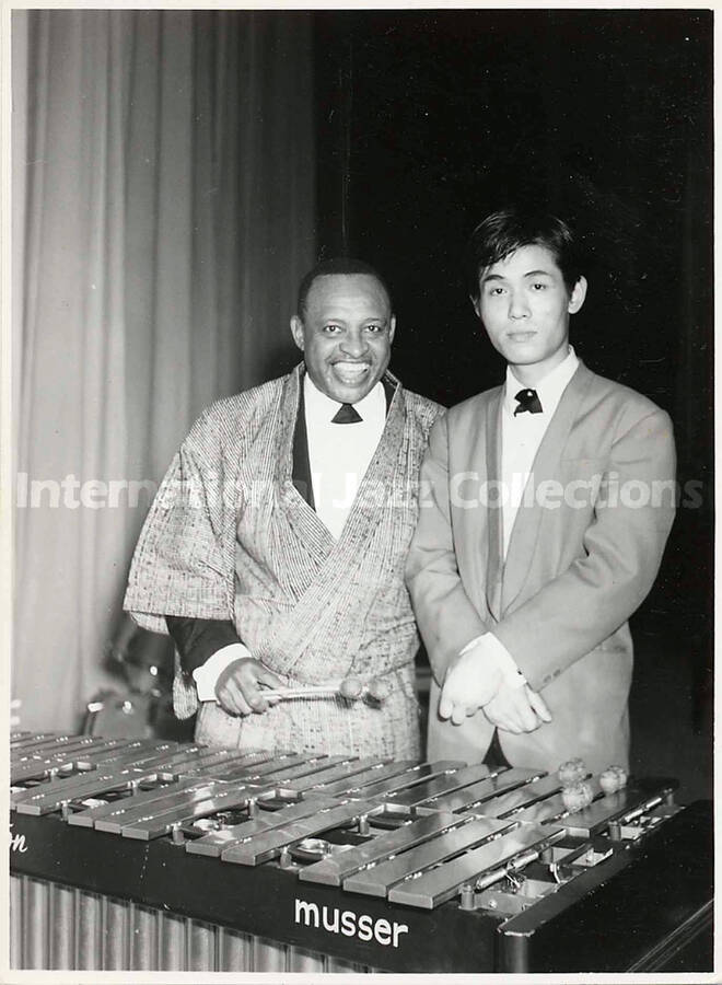 6 1/2 x 4 1/2 inch photograph. Lionel Hampton with unidentified man, [in Japan]