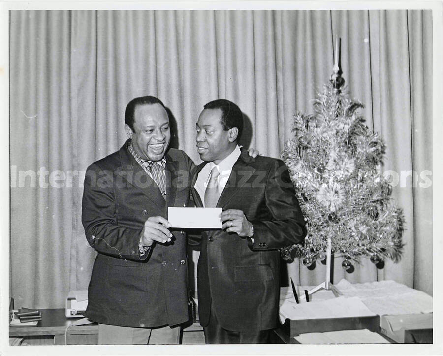 7 1/2 x 9 1/2 inch photograph. Lionel Hampton with unidentified man
