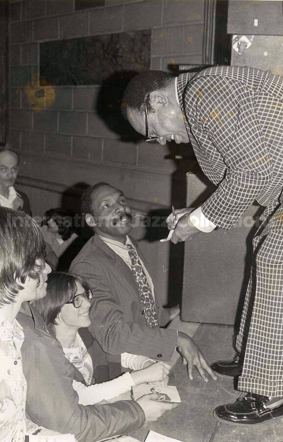 10 1/4 x 6 3/4 inch photograph. Lionel Hampton autographing for fans