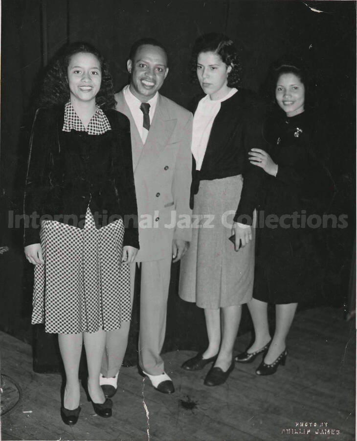 10 x 8 inch photograph. Lionel Hampton with three unidentified women