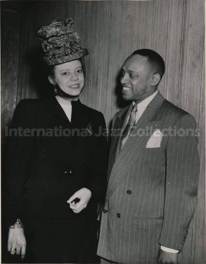 9 1/2 x 7 1/2 inch photograph. Lionel Hampton with unidentified woman