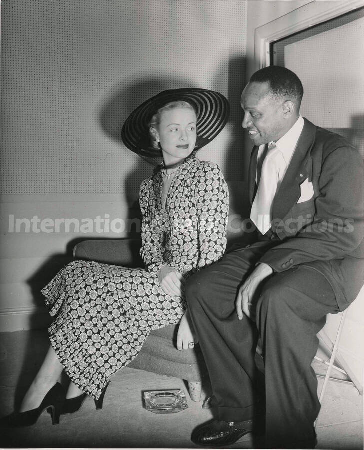 10 x 8 inch photograph. Lionel Hampton with unidentified woman at the NBC studio