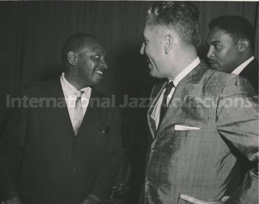 8 x 10 inch photograph. Lionel Hampton with unidentified men during his visit to the Keesler Air Force Base, in Biloxi, MS