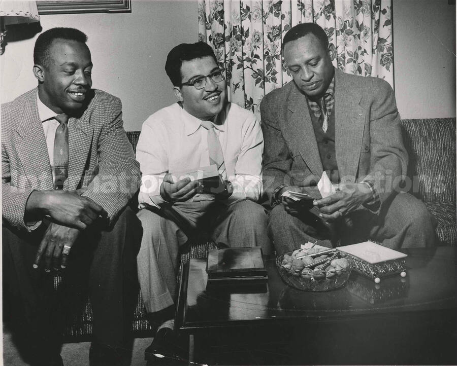 8 x 10 inch photograph. Lionel Hampton with two unidentified men