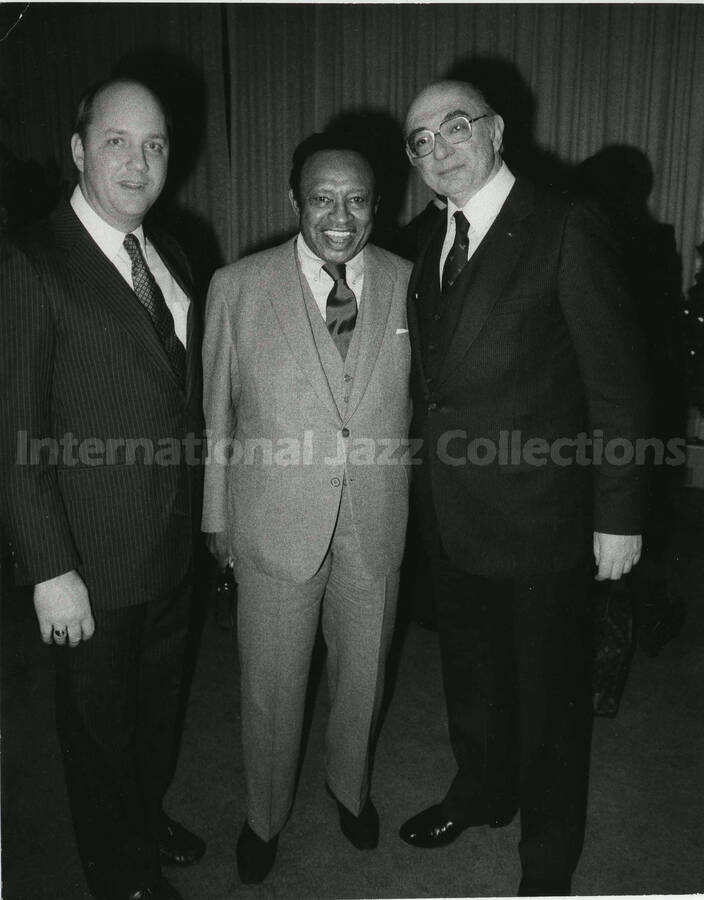 10 x 8 inch photograph. Lionel Hampton with two unidentified men, on the occasion of his receiving a plaque from the United States Mission that appointed him as Ambassador of Music to the United Nations