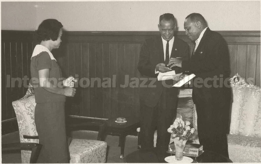 3 1/2 x 5 1/2 inch photograph. Lionel Hampton with Pol. Col Luen Krisanamara Asst. Lord Mayor of Bangkok (Thailand) and City Clerk Mrs. Nandaka Wattanakorn