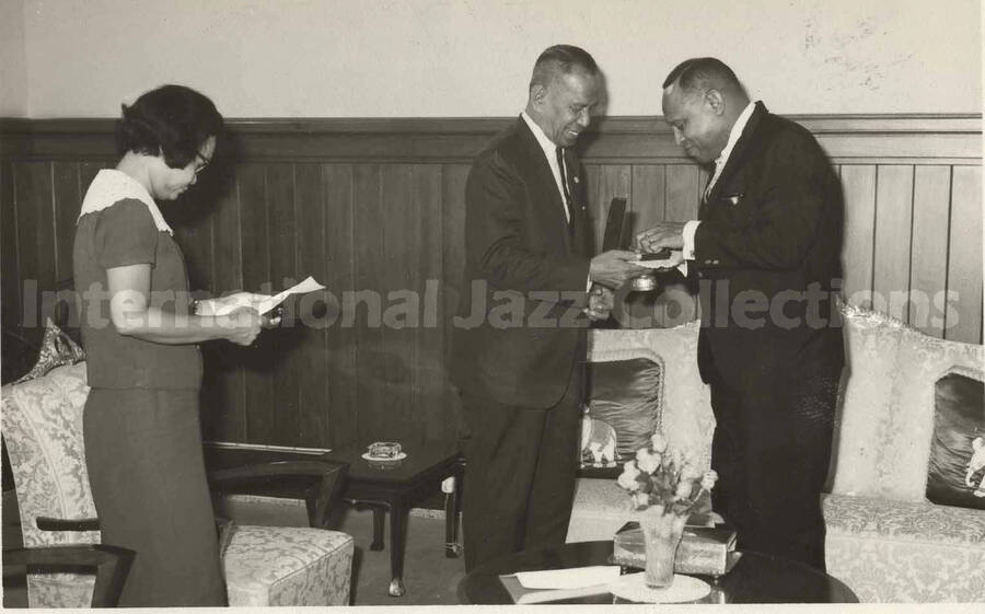 3 1/2 x 5 1/2 inch photograph. Lionel Hampton in Thailand. Typewritten on the back of the photograph: Called on Councillor; Pol. Col Luen Krisanamara; Asst. Lord Mayor of Bangkok and City Clerk Mrs. Nandaka Wattanakorn