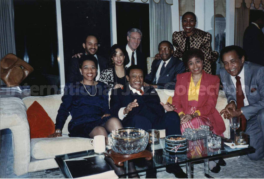 4 x 6 inch photograph. Lionel Hampton with unidentified persons at the Webber residence, in Charlotte, N.C.