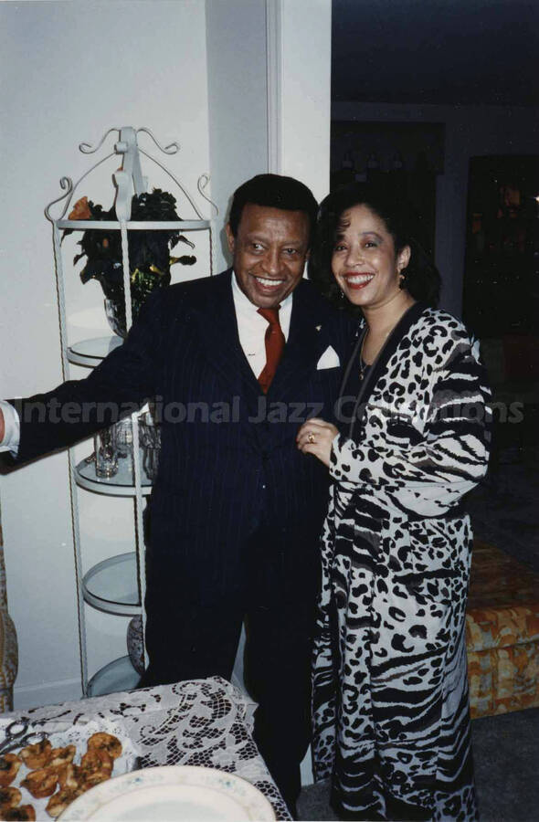 4 x 6 inch photograph. Lionel Hampton with Charlene Price Patterson at the Webber residence, in Charlotte, N.C.
