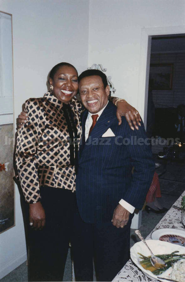 4 x 6 inch photograph. Lionel Hampton with Jean Webber at the Webber residence, in Charlotte, N.C.