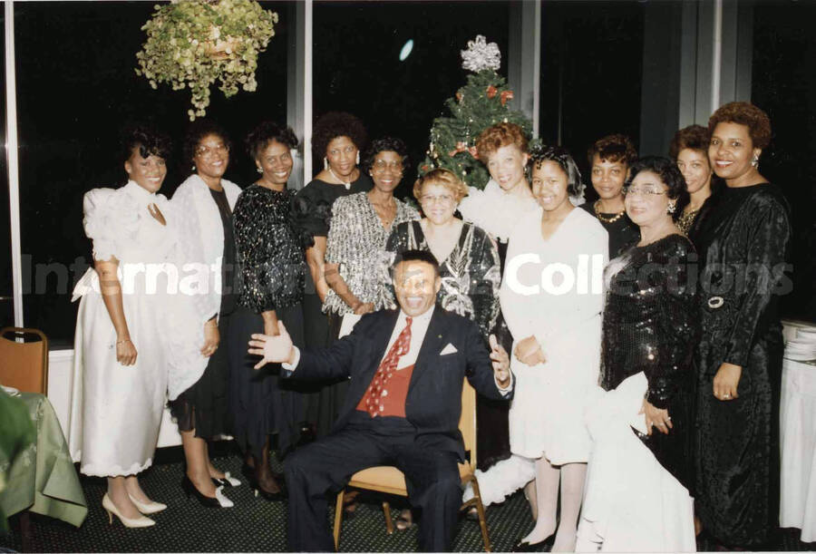 4 x 6 inch photograph. Lionel Hampton posing with members of the National Council of Negro Women, in Jacksonville, FL. This photograph is dedicated to Lionel Hampton