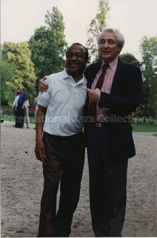 6 x 4 inch photograph. Bill Titone with unidentified man, on the occasion of a ceremony related to wine, [in France]