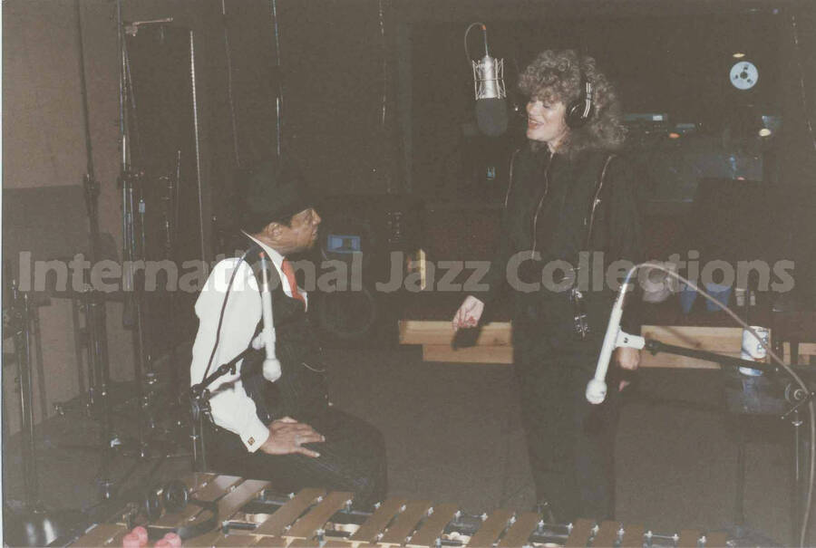4 x 6 inch photograph. Lionel Hampton with Sylvia Bennett in a recording studio