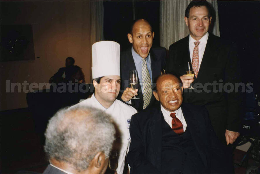 4 x 6 inch photograph. Lionel Hampton with unidentified persons at a reception