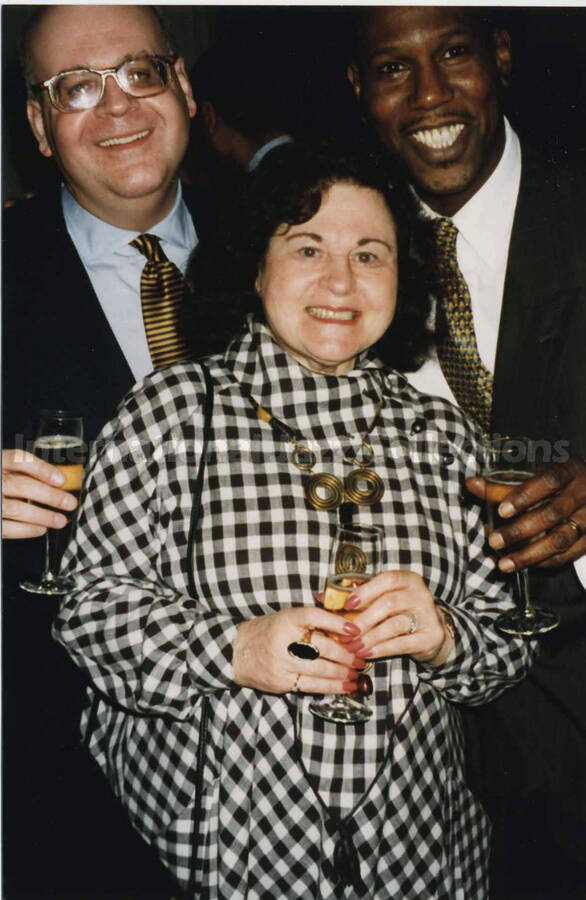 6 x 4 inch photograph. Reuben, Lionel Hampton's valet, with two unidentified people.