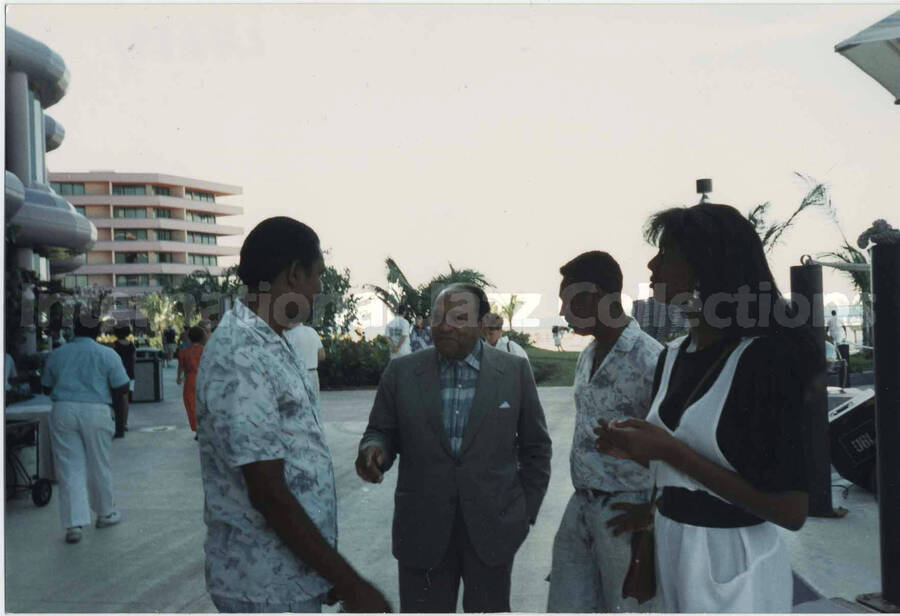 4 x 6 inch photograph. Lionel Hampton standing outside with three unidentified persons