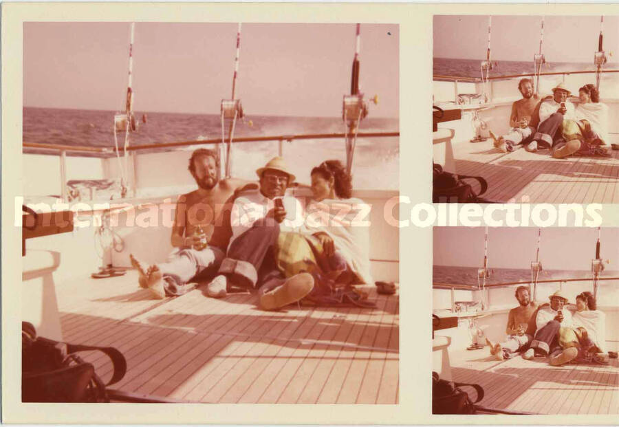 3 1/2 x 5 inch photograph. Lionel Hampton on a boat with Jean Claude Forestier and unidentified woman