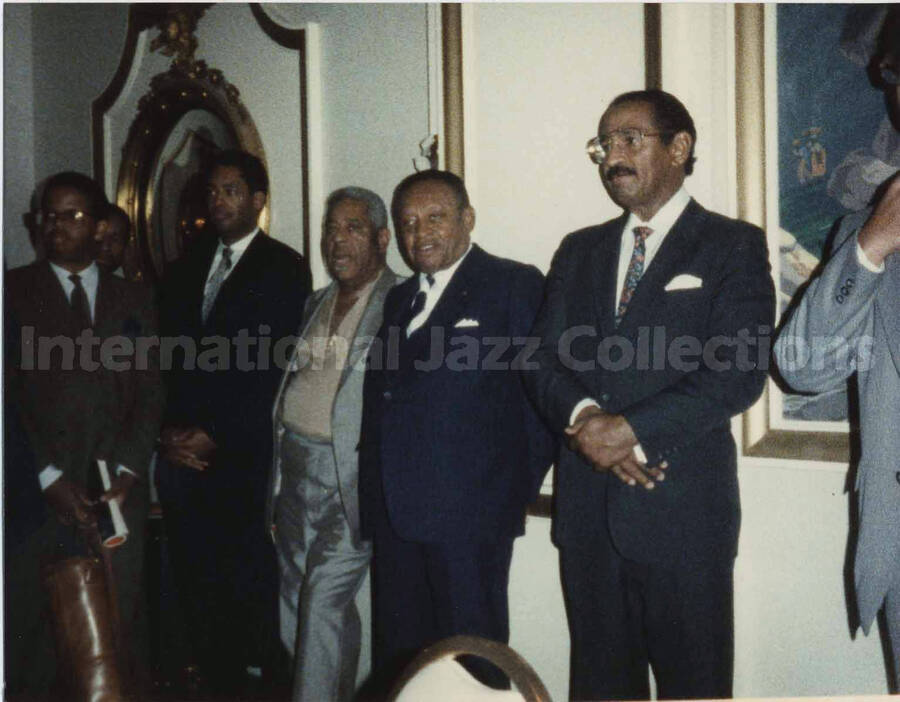 4 x 5 inch photograph. Lionel Hampton with unidentified musicians at a reception