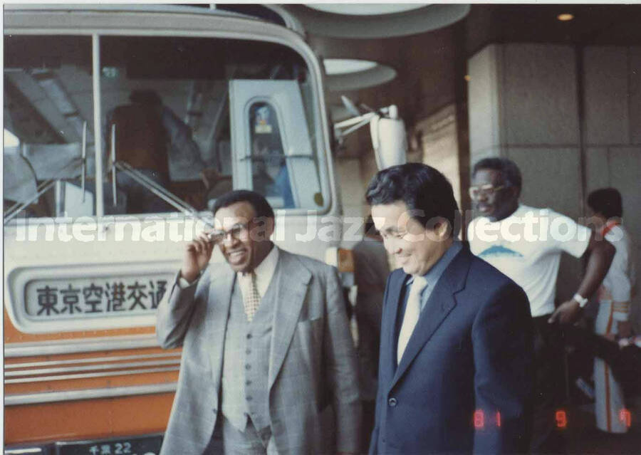 3 1/4 x 4 1/2 inch photograph. Lionel Hampton with unidentified man [in Japan?]
