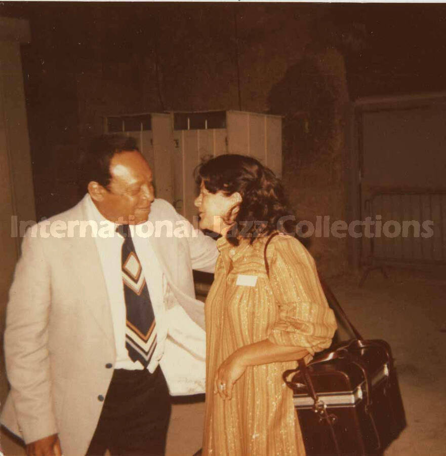 3 1/2 x 3 1/2 inch photograph. Lionel Hampton with unidentified woman