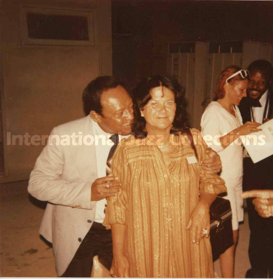 3 1/2 x 3 1/2 inch photograph. Lionel Hampton with unidentified woman