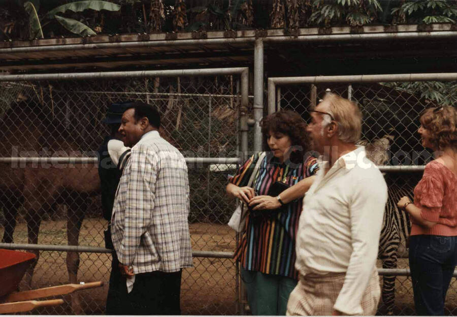 3 1/2 x 5 inch photograph. Lionel Hampton walking through a zoo