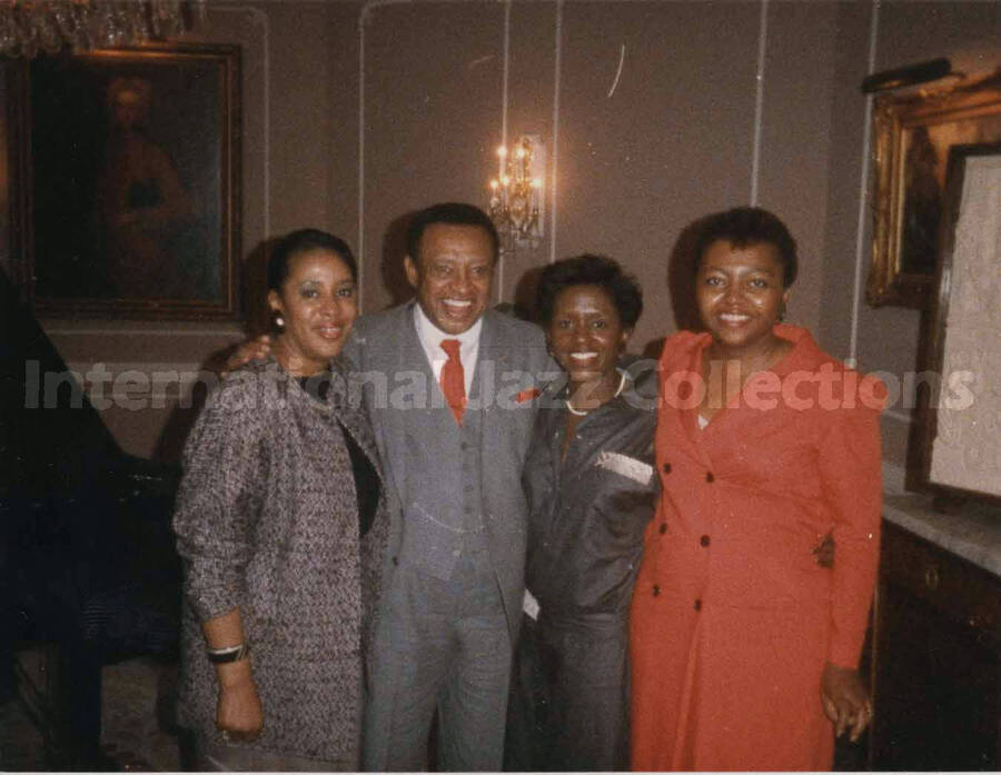 3 1/2 x 4 1/2 inch photograph. Lionel Hampton with unidentified women