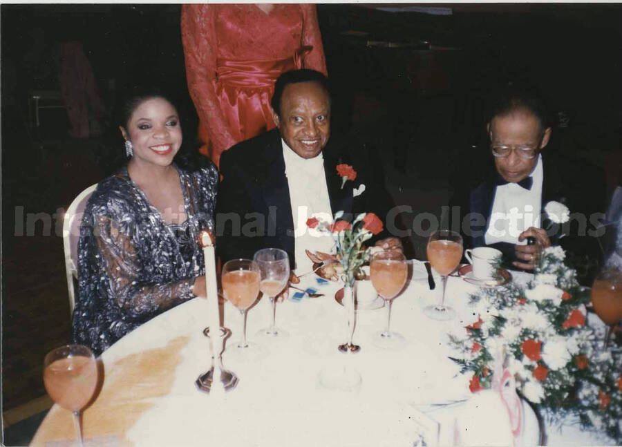 3 1/2 x 5 inch photograph. Lionel Hampton with unidentified woman at a wedding dinner