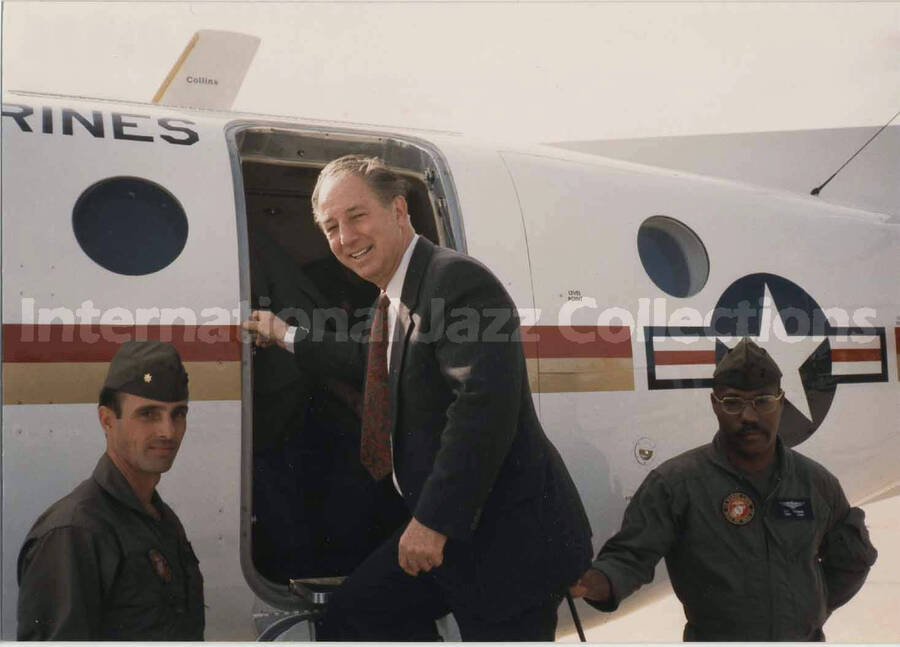 3 1/2 x 5 inch photograph. Unidentified man boarding a US Marines airplane