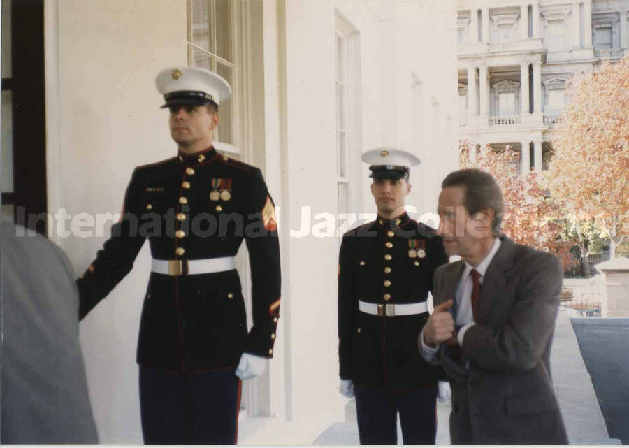 3 1/2 x 5 inch photograph. Three unidentified men; two are in Marine Corps uniforms