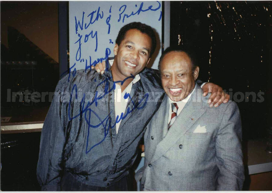 3 1/2 x 5 inch photograph. Lionel Hampton with a man. This photograph is dedicated to Lionel Hampton from Clifton Davis[?]